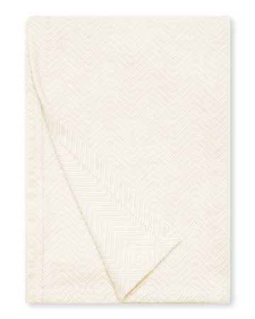 Cream-colored shawl with herringbone weave pattern, folded to show texture and drape.6