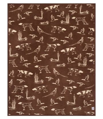 Brown blanket with cream-colored hunting dog and bird illustrations scattered throughout.8