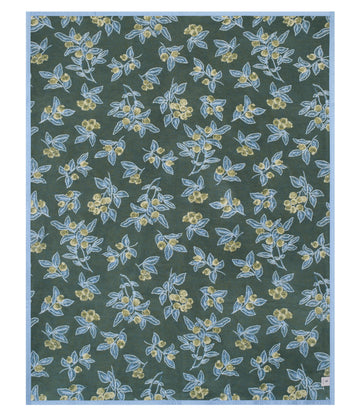 Dark green blanket with scattered yellow flowers and blue-green leaves in an all-over botanical print pattern.7