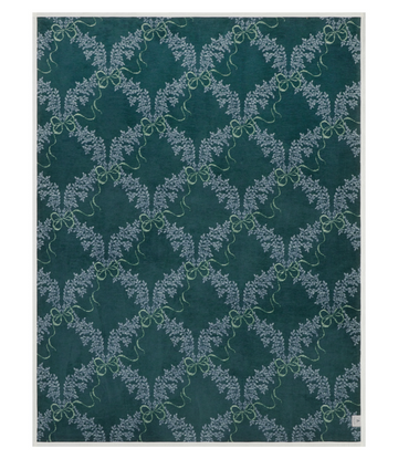 Teal blanket with repeating pattern of light blue boxwood wreaths tied with bows.8