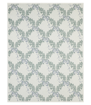 Cream blanket with repeating pattern of green boxwood wreaths tied with blue bows.7