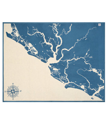 Blue and cream blanket with map showing Charleston and Kiawah areas with waterways and compass rose.4