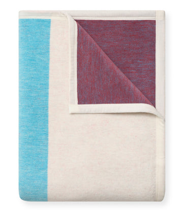 Cream blanket with turquoise left stripe and burgundy folded corner section.4
