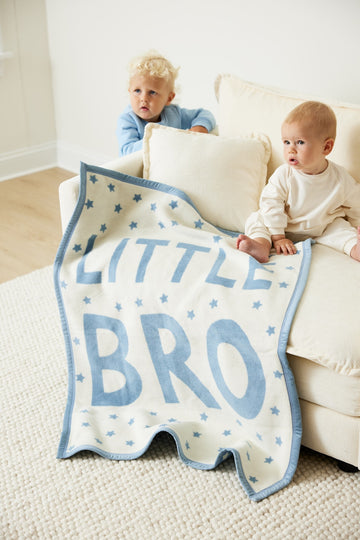 Cream and blue blanket with "Little Bro" text and star pattern, displayed with two toddlers on a couch.5