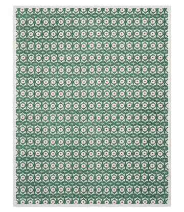 Green blanket with repeating pattern of pink and cream flowers arranged in geometric diamond shapes.11