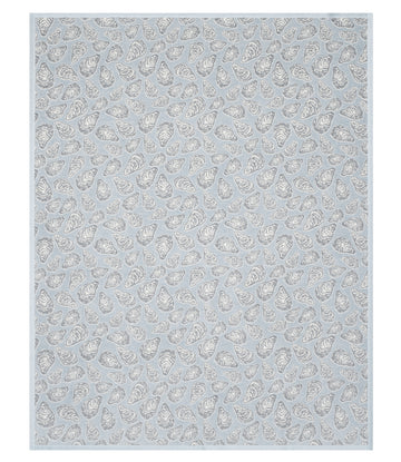 Gray blanket with white oyster shell pattern throughout.6