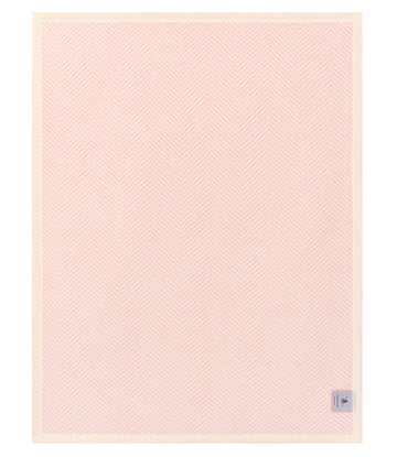 Pink mini blanket with herringbone pattern and cream border, small label on lower right corner.7