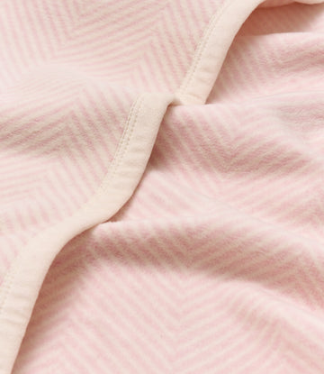 Pink herringbone woven blanket with cream binding along the edge, displayed folded.4