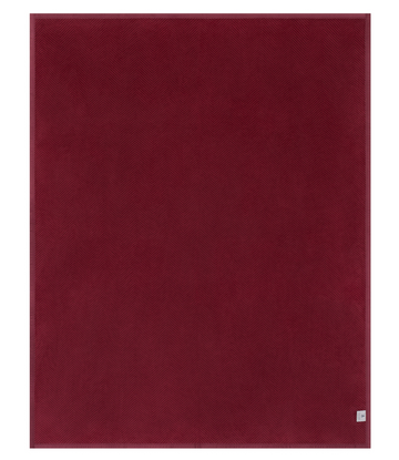 Cranberry-colored blanket with herringbone weave texture throughout.9