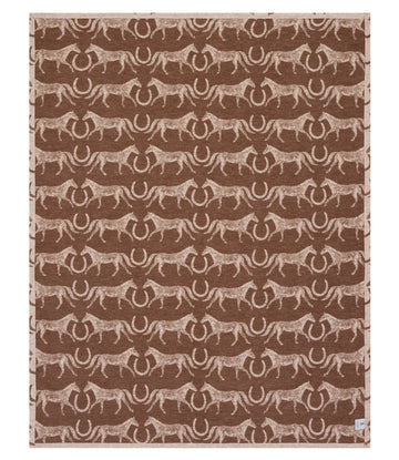 Brown and tan blanket with repeated pattern of horses and horseshoes throughout.7