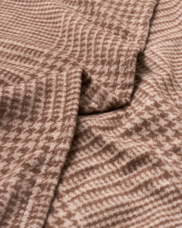 Brown plaid woven shawl with textured fabric and diagonal fold detail.7