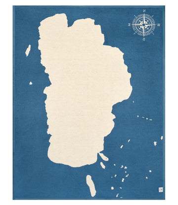 Cream-colored Lake Tahoe map on blue background with compass rose and surrounding islands.5