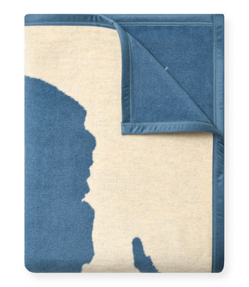 Folded blanket with blue and cream Lake Tahoe map design, showing both sides of the fabric.4