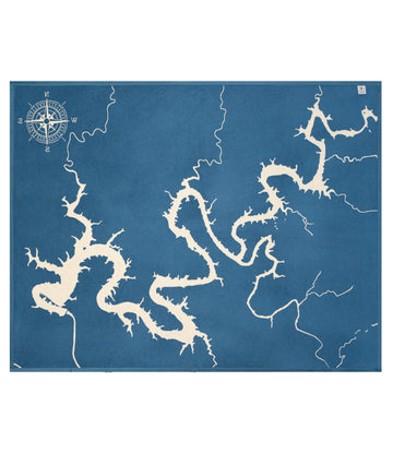 Blue blanket featuring cream-colored Lake Travis map outline with compass rose and surrounding waterways.5