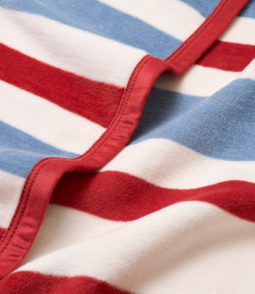 Red, white, and blue striped blanket with red binding along the edge.7