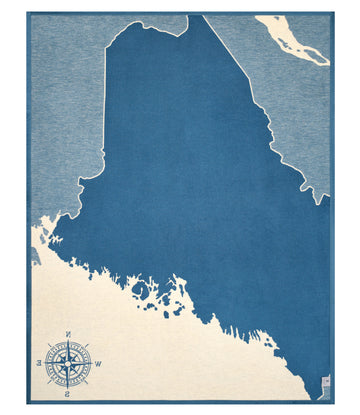 Maine state map in dark blue with cream-colored border and compass rose, surrounded by light blue background.5