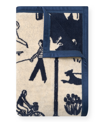 Cream and navy blanket with dark blue binding featuring silhouettes of people and dogs in various park activities.6