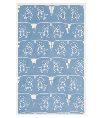 Blue and cream midi blanket with repeating white line-drawn sailor dogs wearing sailor hats and rope borders.7