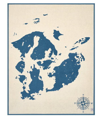 Cream blanket with dark blue San Juan Islands map and compass rose design on border.5