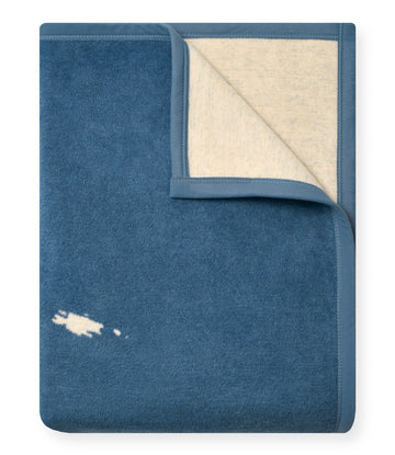 Blue wool blanket with cream-colored reverse side and embroidered San Juan Islands map design.4