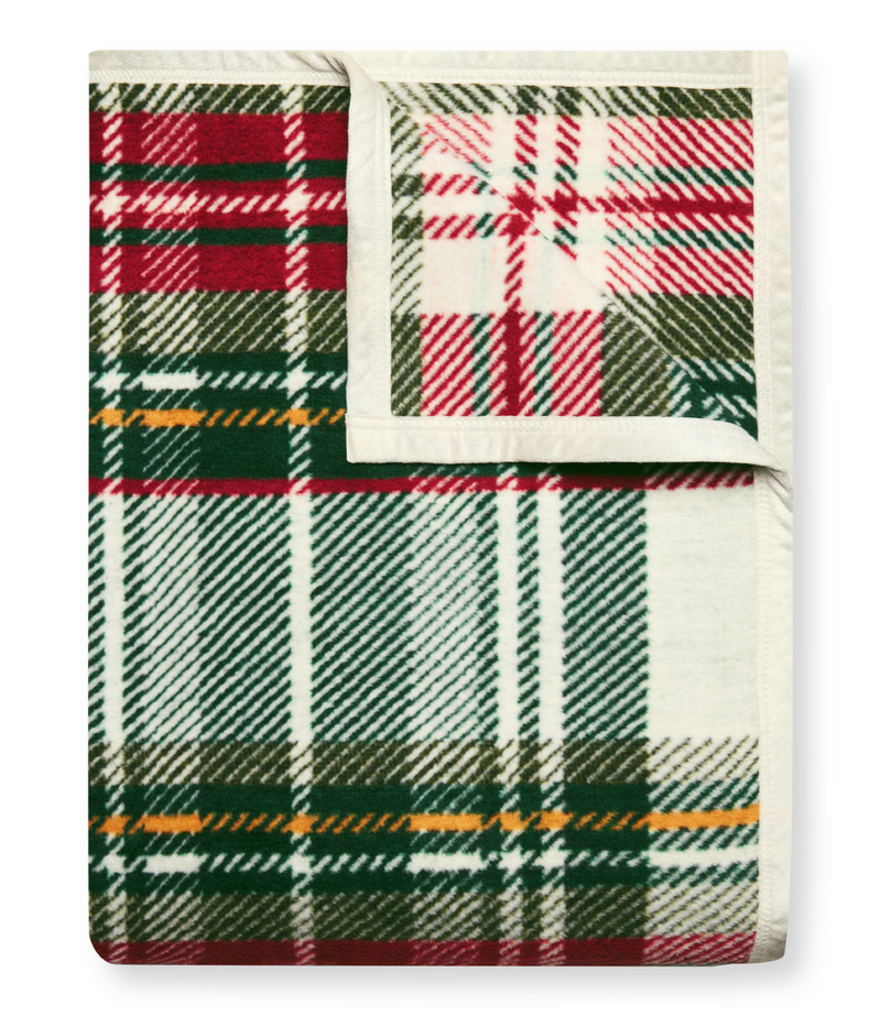 Red, green, and cream plaid blanket with yellow stripe detail and cream binding edges.