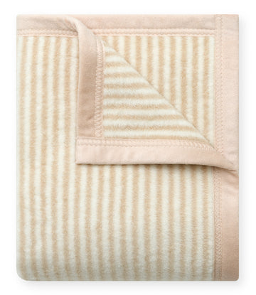 Folded mini blanket with tan and cream vertical stripes and solid tan border.3