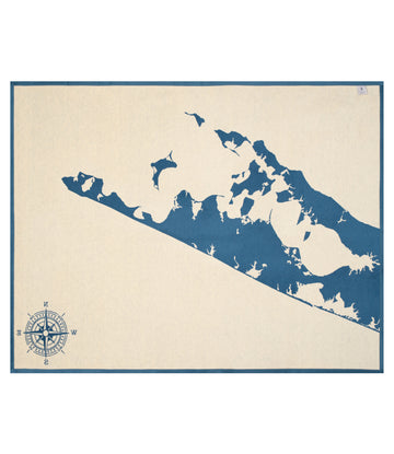 Cream blanket with dark blue map of the Hamptons region and compass rose in lower left corner.4