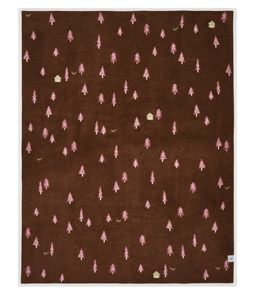 Brown blanket with scattered pink trees, small cabins, and birds throughout.8