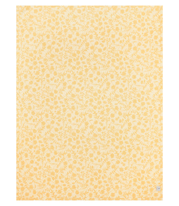 Yellow and cream lightweight blanket with repeating daffodil and leaf pattern throughout.6