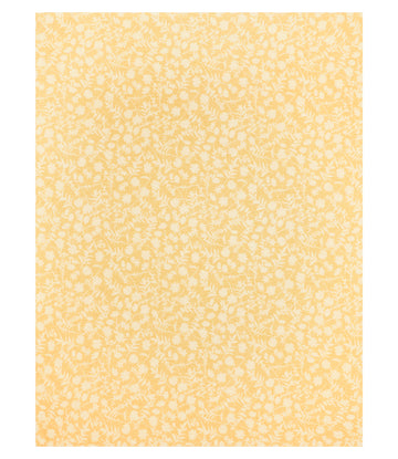 Yellow lightweight blanket with white floral and leaf pattern throughout.3